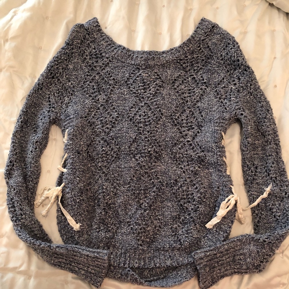 Lace-up blue sweater.